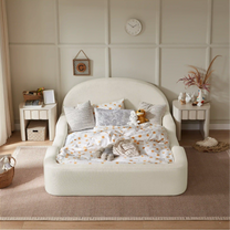 Children's room with a bed, toys, and decorative items on a neutral background
